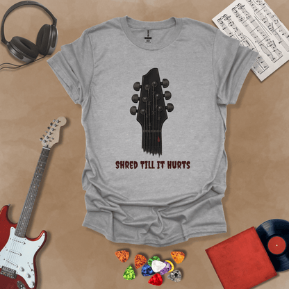 Gray t-shirt with distressed guitar graphic, text “Shred ’Til It Hurts.”