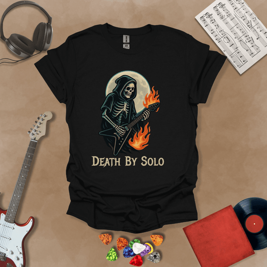 Black t-shirt with a graphic of a grim reaper skeleton playing a flaming V-style guitar under a glowing full moon, with the text “Death By Solo” below.
