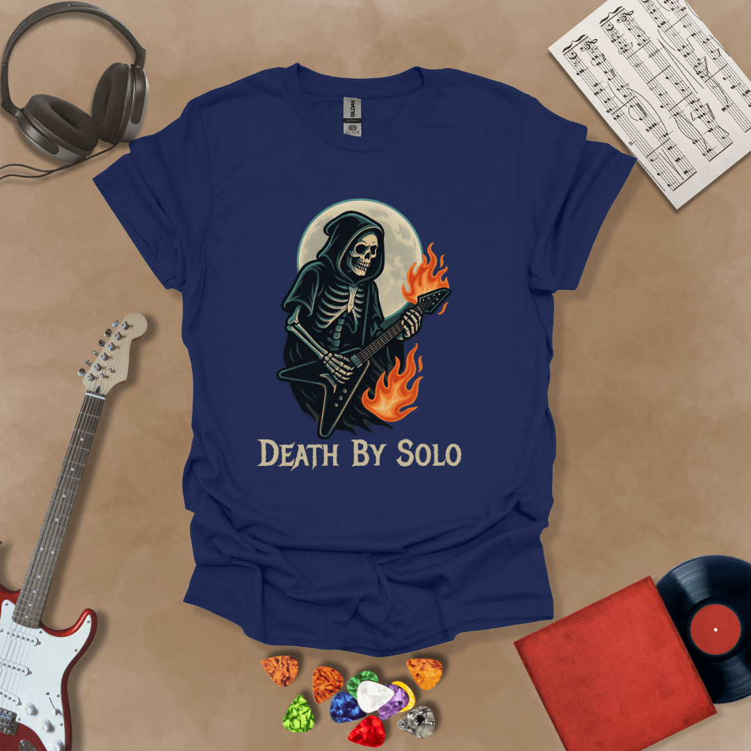 Navy t-shirt with a graphic of a grim reaper skeleton playing a flaming V-style guitar under a glowing full moon, with the text “Death By Solo” below.

