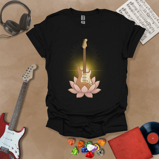 Black t-shirt with glowing guitar blooming from a lotus flower, radiant petals spreading.
