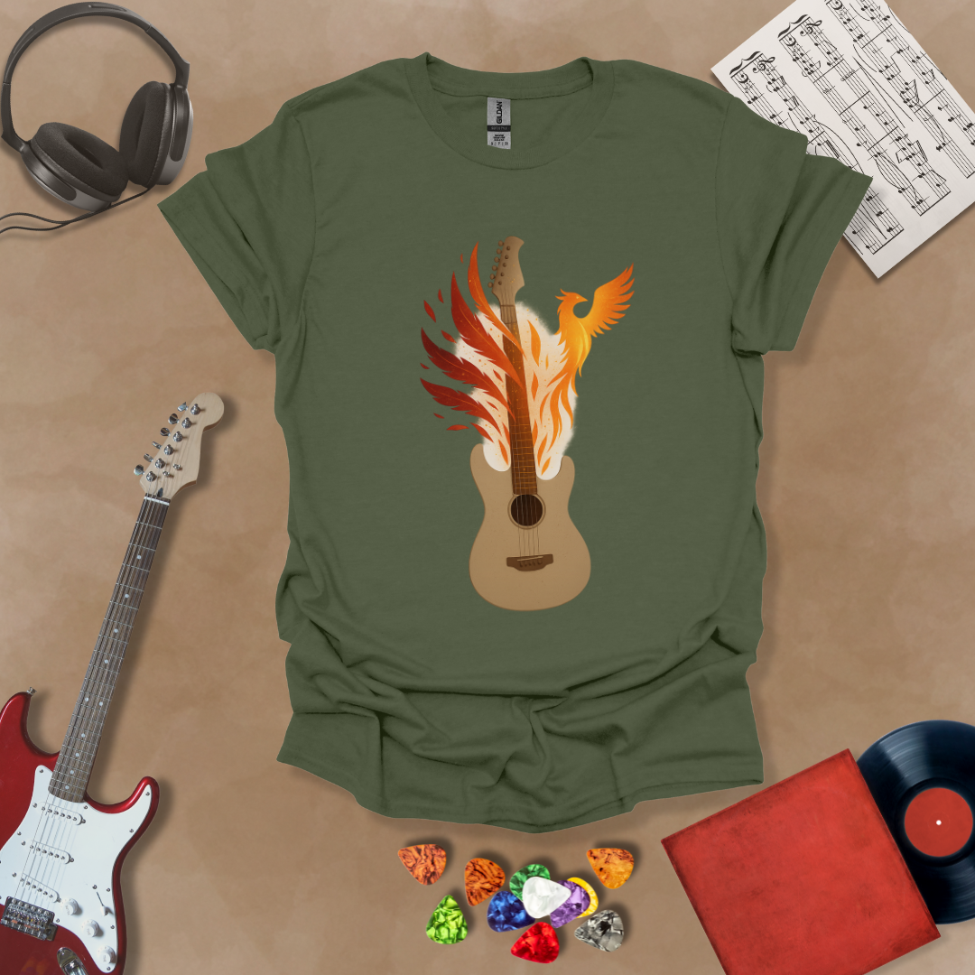Green T-shirt featuring a fiery phoenix rising with wings ablaze, intertwined with a guitar, symbolizing rebirth and the eternal power of music.