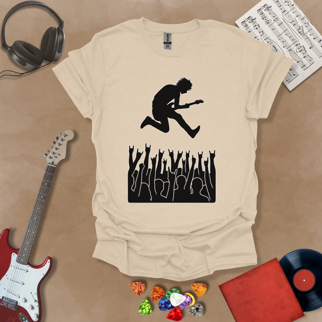 Beige t-shirt with silhouette of guitarist diving into crowd.
