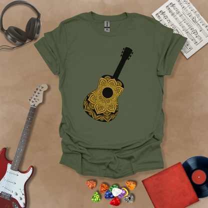 Green t-shirt with mandala pattern shaped like guitar body.
