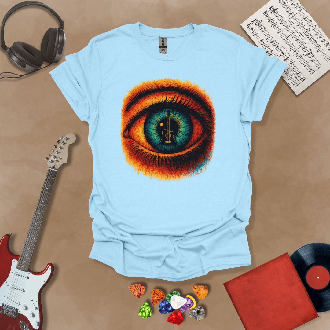 Light blue t-shirt featuring a fiery psychedelic eye with a glowing iris and a guitar silhouette at the center of the pupil.
