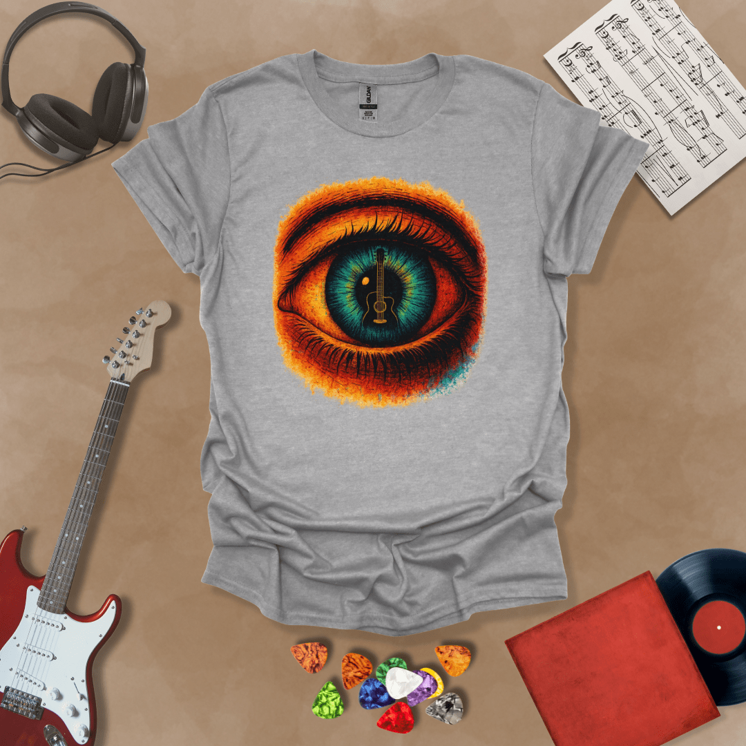 Gray t-shirt featuring a fiery psychedelic eye with a glowing iris and a guitar silhouette at the center of the pupil.
