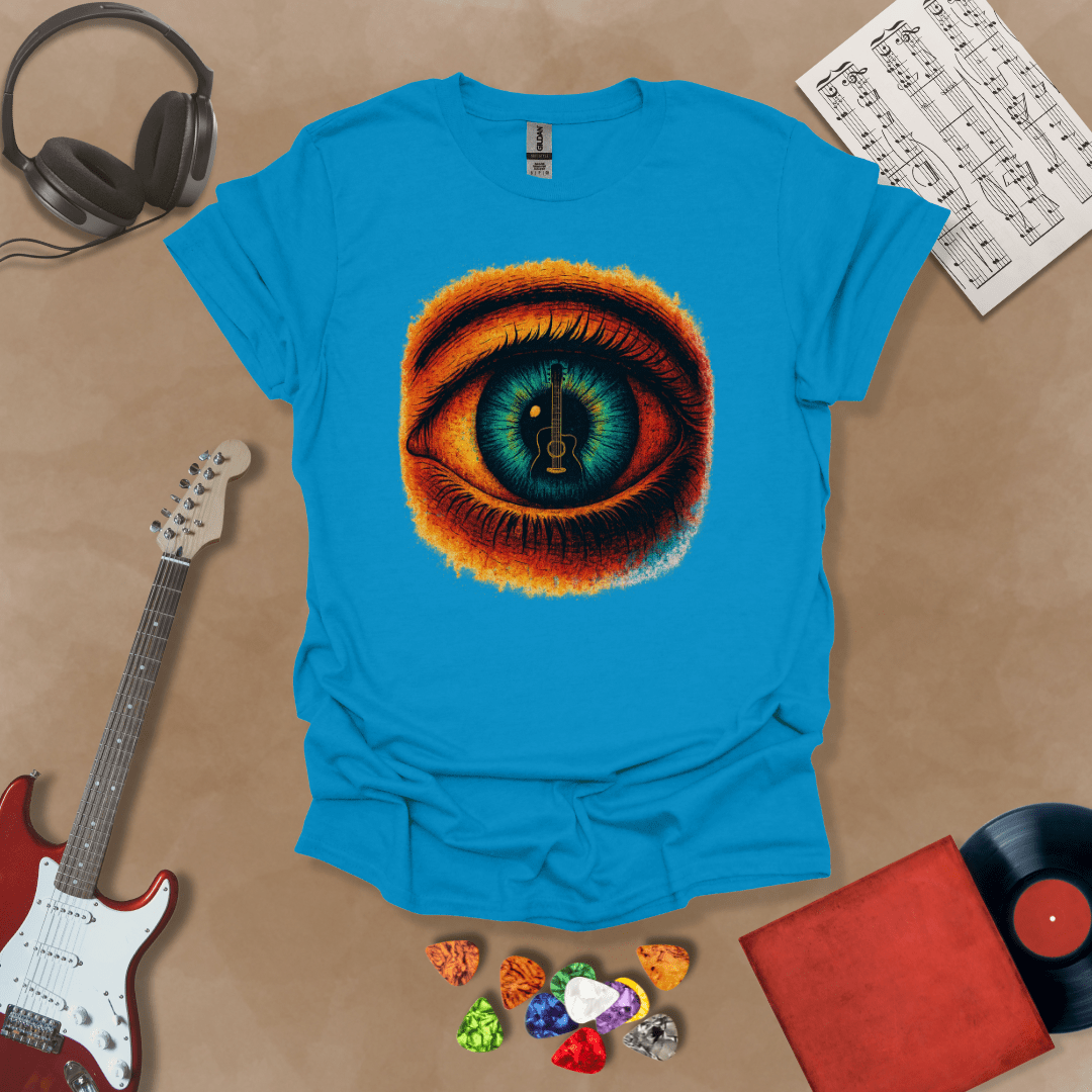Blue t-shirt featuring a fiery psychedelic eye with a glowing iris and a guitar silhouette at the center of the pupil.
