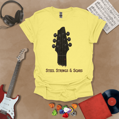 Yellow t-shirt featuring a guitar headstock with razor-wire steel strings and a drop of blood, with the text “Steel Strings & Scars” below.
