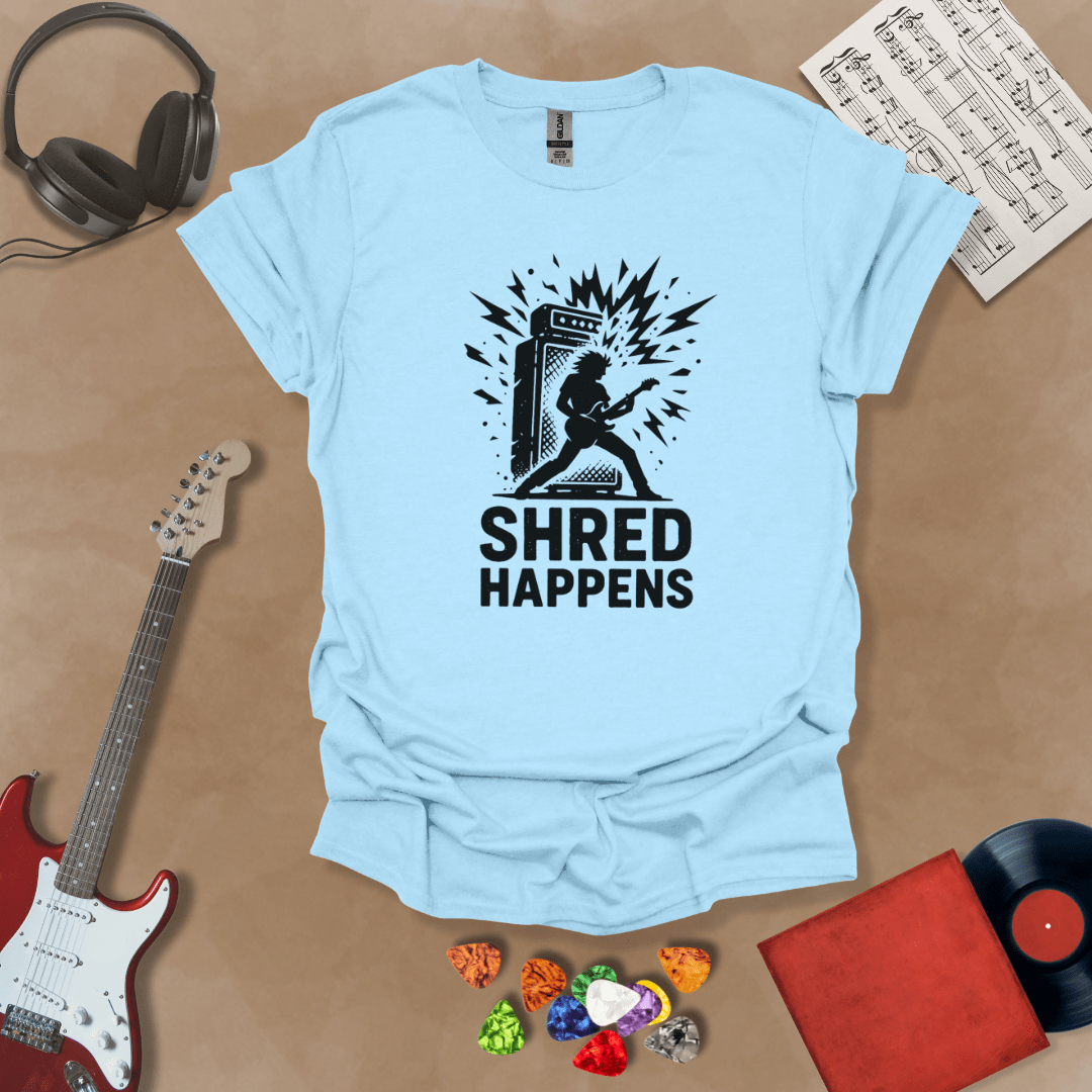 Light Blue t-shirt with Guitarist shredding in front of amp with text 'Shred Happens'