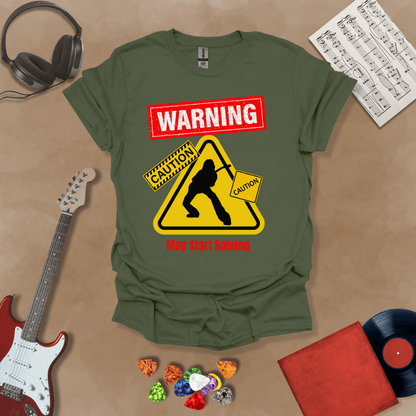 Green t-shirt with bold red “Warning” text, yellow caution triangle with guitarist silhouette, text “May Start Soloing.”

