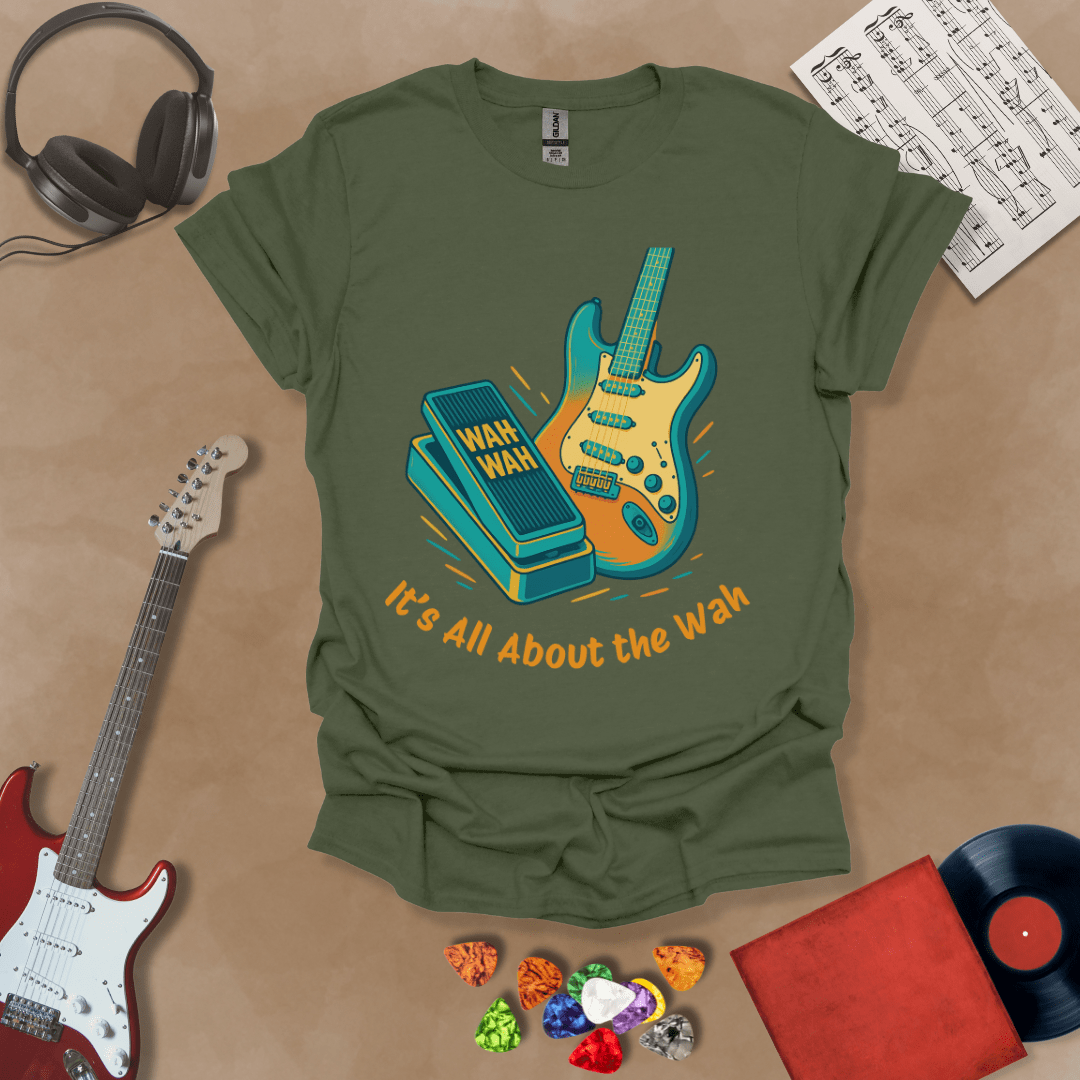 green t-shirt with bright color graphic guitar and wah wah pedal with text "It's all about the wah". 