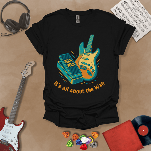 Black t-shirt with bright color graphic guitar and wah wah pedal with text "It's all about the wah". 