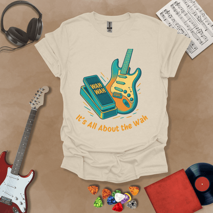 Beige t-shirt with bright color graphic guitar and wah wah pedal with text "It's all about the wah". 