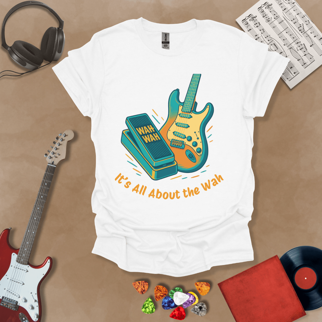 White t-shirt with bright color graphic guitar and wah wah pedal with text "It's all about the wah". 