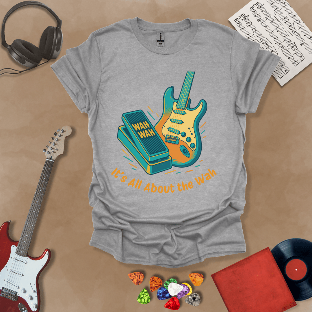 Gray t-shirt with bright color graphic guitar and wah wah pedal with text "It's all about the wah". 