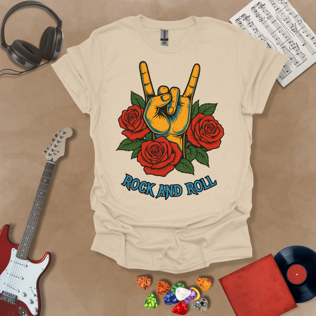Beige t-shirt with orange hand in devil horns gesture, surrounded by red roses, text “Rock and Roll.”