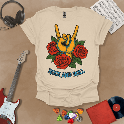 Beige t-shirt with orange hand in devil horns gesture, surrounded by red roses, text “Rock and Roll.”