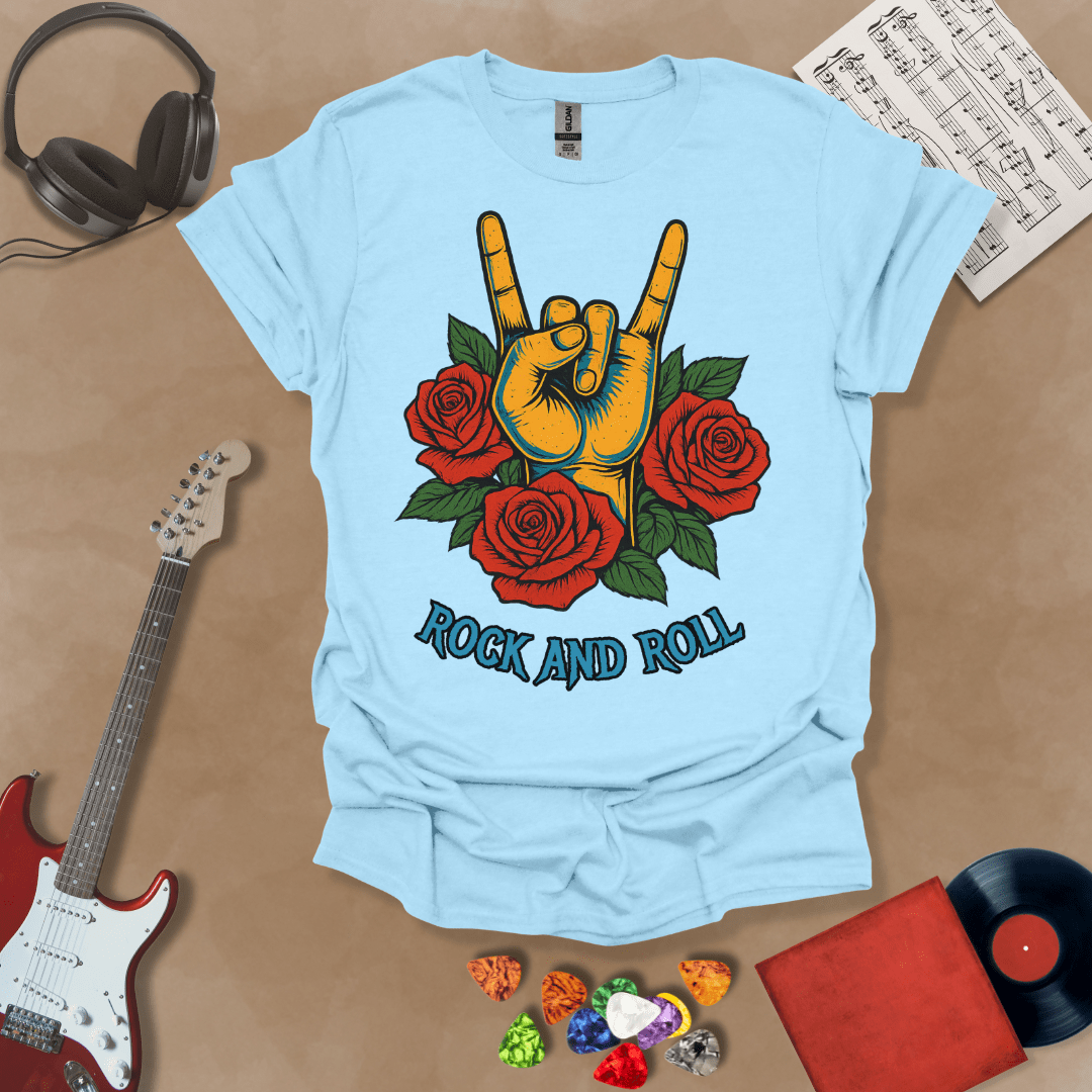 Light Blue t-shirt with orange hand in devil horns gesture, surrounded by red roses, text “Rock and Roll.”