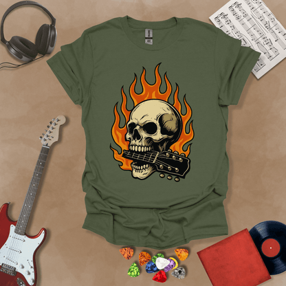 Green t-shirt with flaming skull graphic biting a guitar neck.