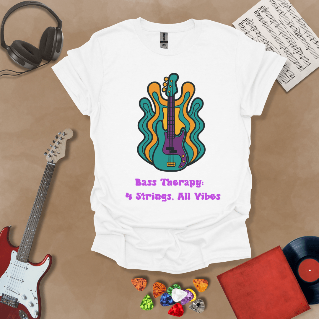 White t-shirt with psychedelic-style bass guitar illustration, colorful wavy accents, text “Bass Therapy: 4 Strings, All Vibes