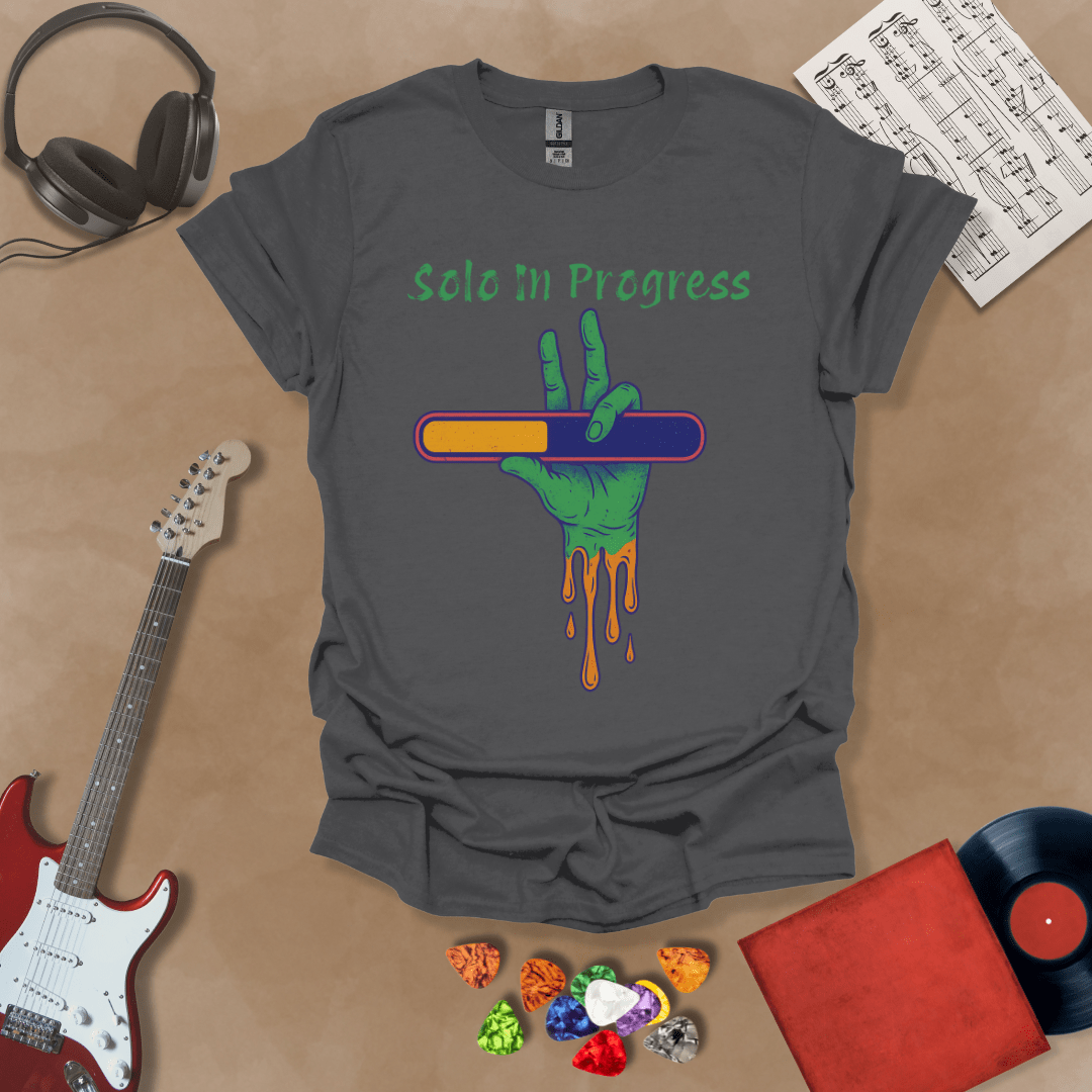 Gray t-shirt with green zombie-like hand holding a colorful loading bar, text “Solo in Progress.”