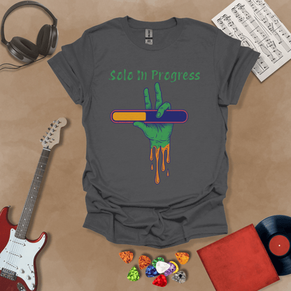 Gray t-shirt with green zombie-like hand holding a colorful loading bar, text “Solo in Progress.”