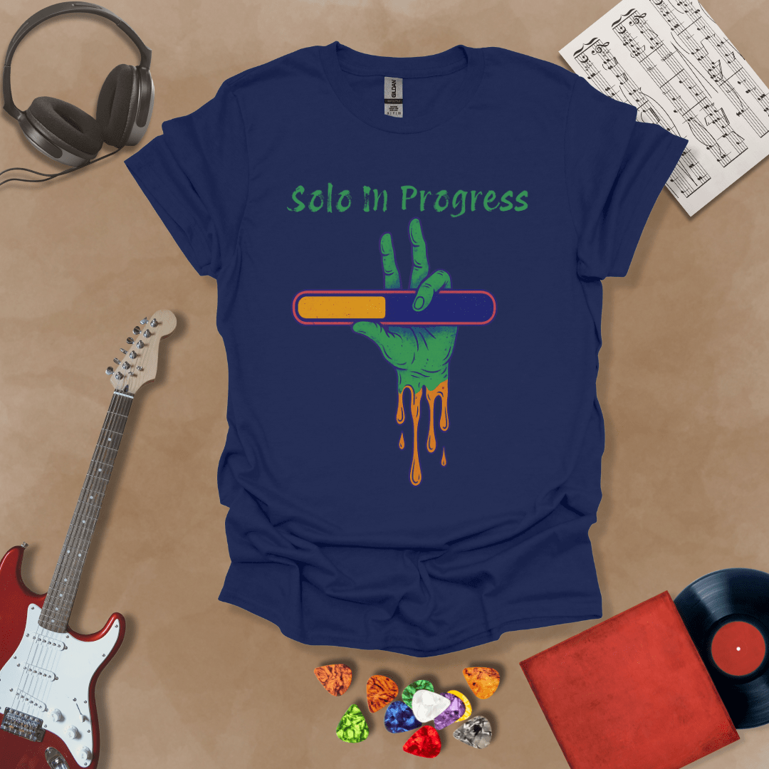 Navy t-shirt with green zombie-like hand holding a colorful loading bar, text “Solo in Progress.”