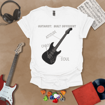 White t-shirt with black electric guitar diagram labeled “Attitude, Chaos, Soul,” text “Guitarist: Built Different.”