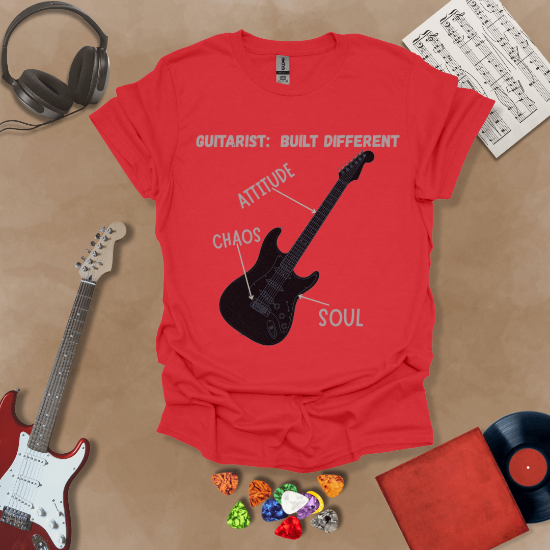 Red t-shirt with black electric guitar diagram labeled “Attitude, Chaos, Soul,” text “Guitarist: Built Different.”