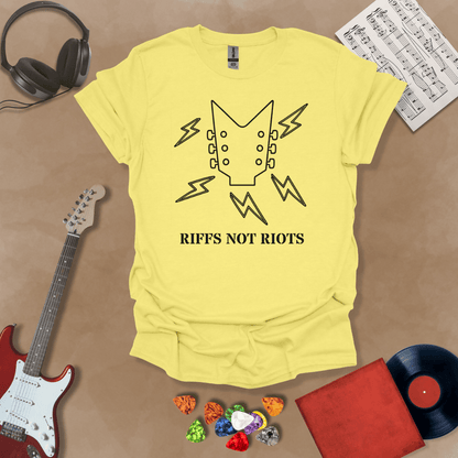 Yellow  t-shirt with black outline of guitar headstock and black lightning bolts, text “Riffs Not Riots.”