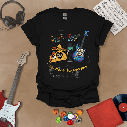 Black t-shirt with cartoon taco wearing sombrero and sunglasses, psychedelic guitar character, text “Will Play Guitar for Tacos.”