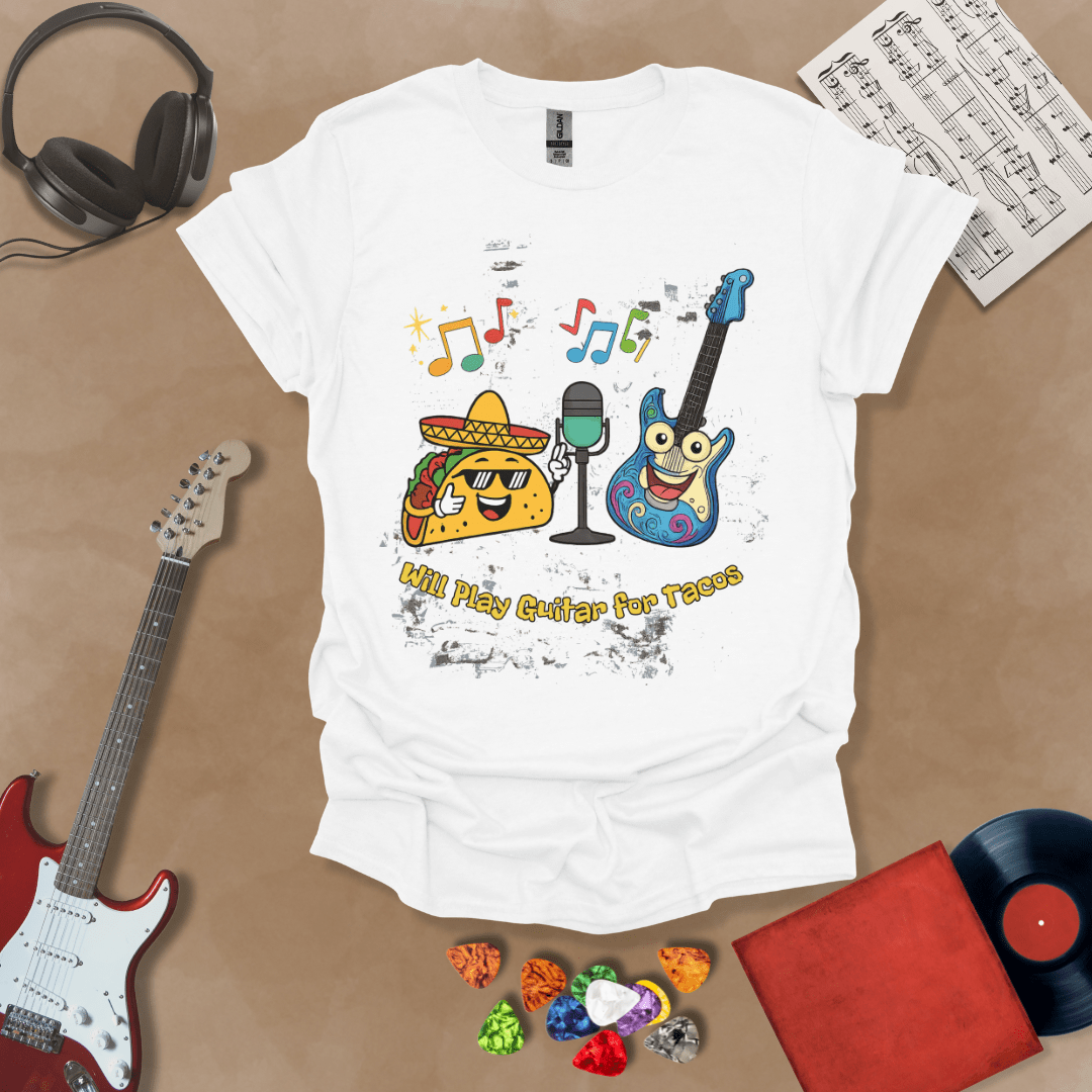 White t-shirt with cartoon taco wearing sombrero and sunglasses, psychedelic guitar character, text “Will Play Guitar for Tacos.”