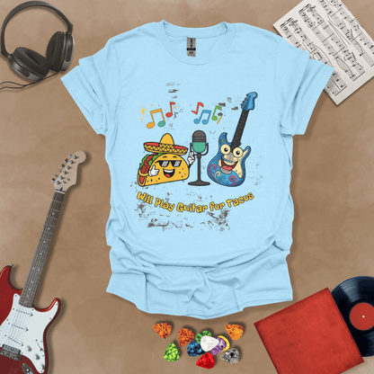 Light blue t-shirt with cartoon taco wearing sombrero and sunglasses, psychedelic guitar character, text “Will Play Guitar for Tacos.”