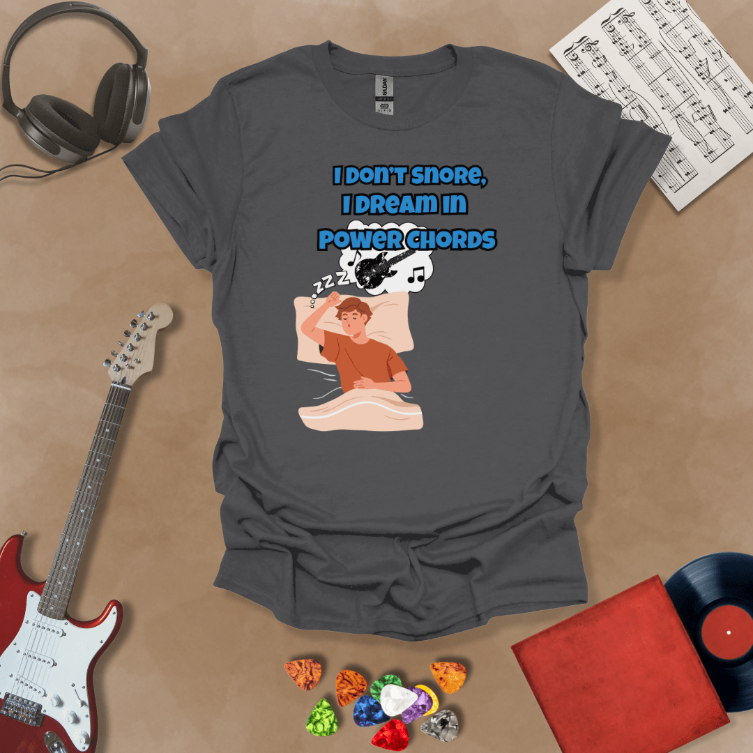 Gray sleeping person, dream bubble with guitar, text “I Don’t Snore, I Dream in Power Chords.”