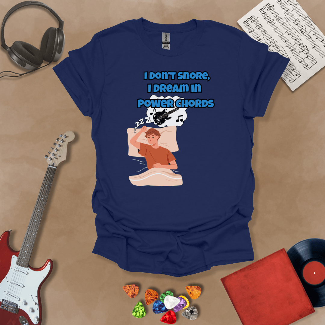 Navy sleeping person, dream bubble with guitar, text “I Don’t Snore, I Dream in Power Chords.”