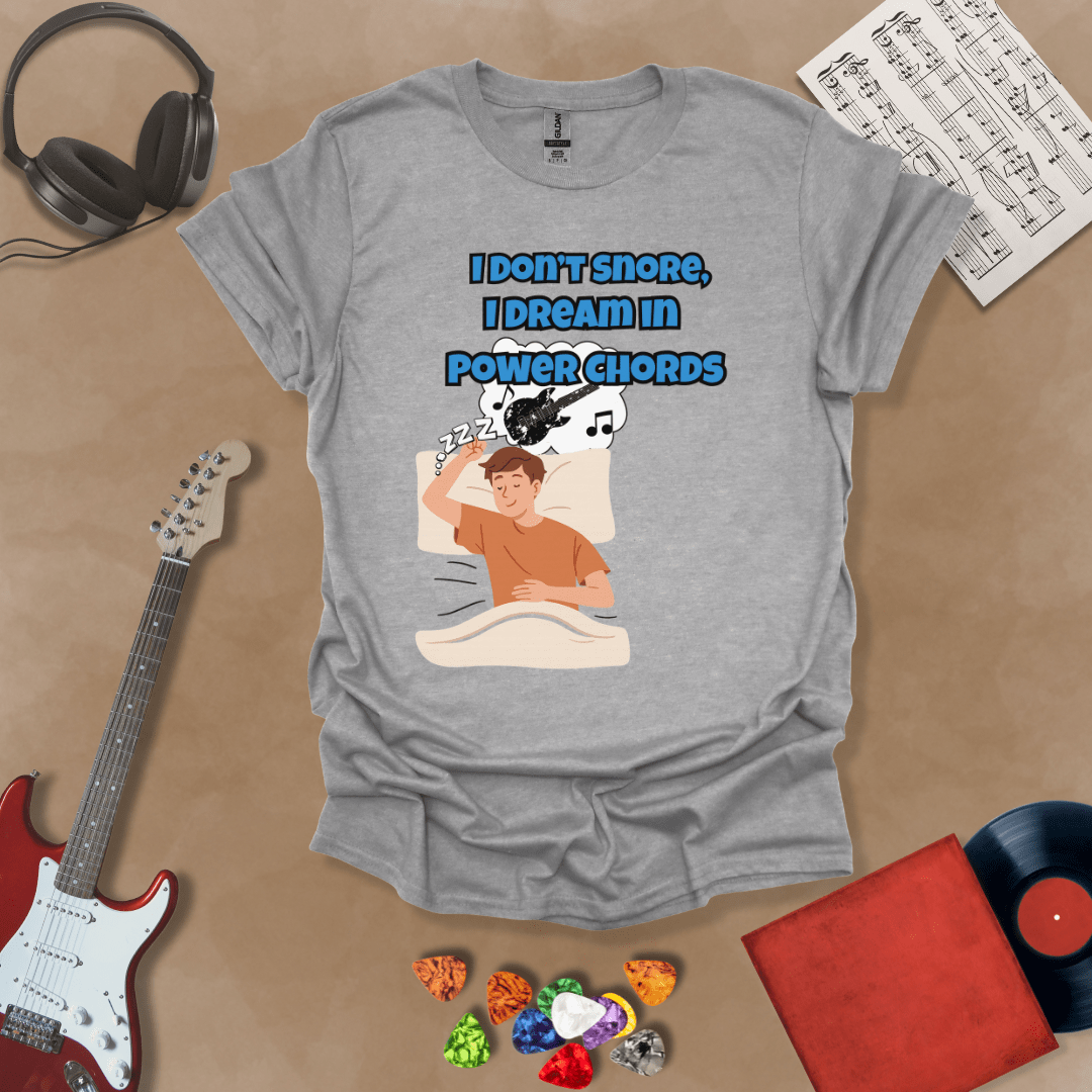 Gray sleeping person, dream bubble with guitar, text “I Don’t Snore, I Dream in Power Chords.”