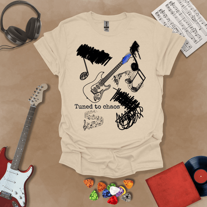 Beige t-shirt with Grunge-style electric guitar design with chaotic abstract lines and the phrase “Tuned to Chaos,” optimized for light shirts like white and sand.