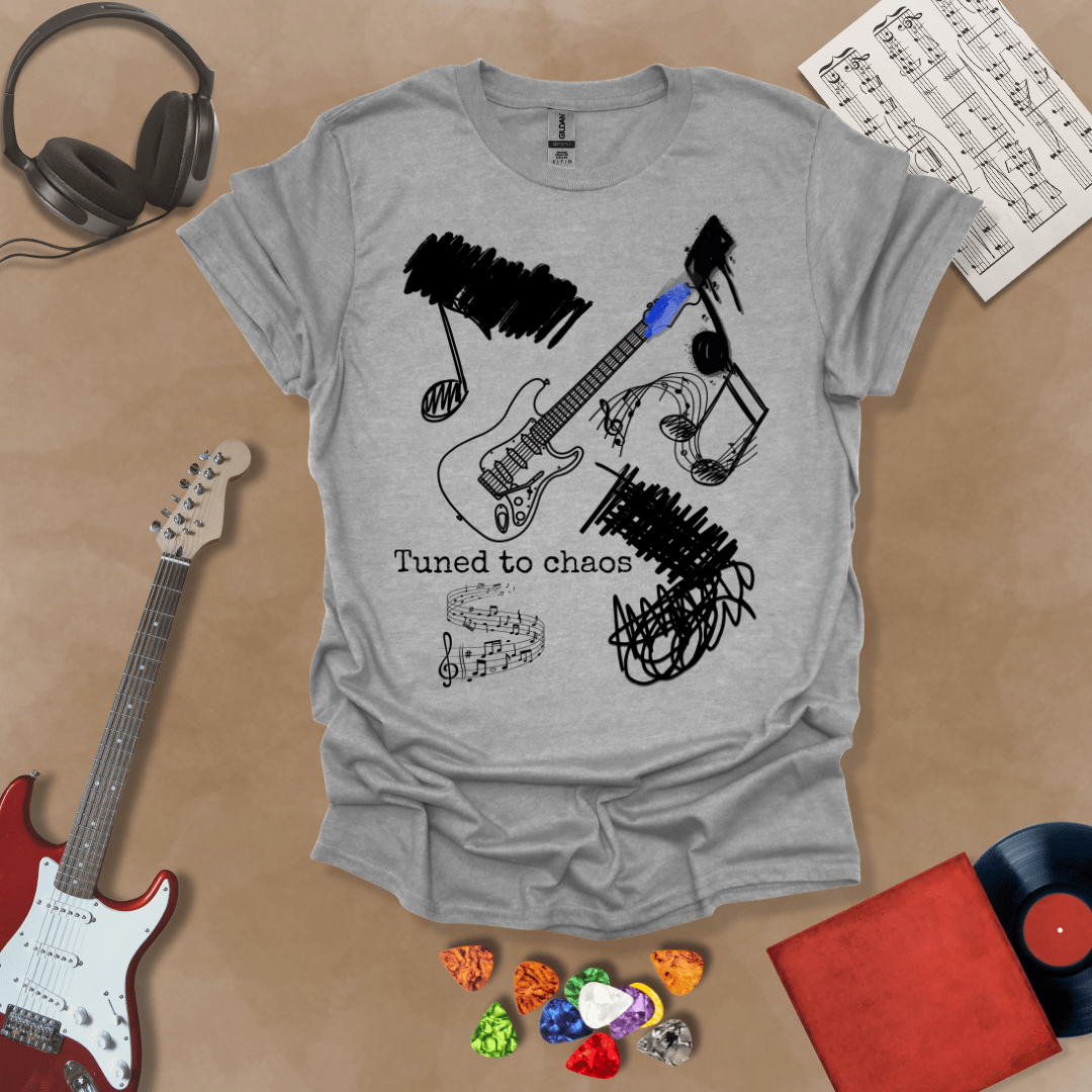 Gray t-shirt with Grunge-style electric guitar design with chaotic abstract lines and the phrase “Tuned to Chaos,” optimized for light shirts like white and sand.