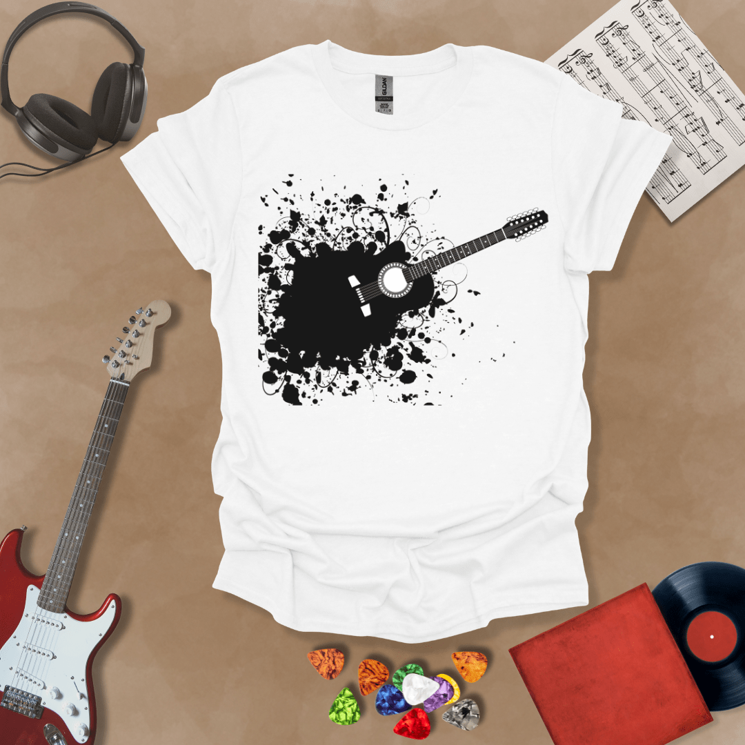 White t-shirt with Abstract splatter-style electric guitar design with six strings exploding outward, bold and edgy graphic.