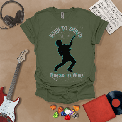 Green t-shirt with Silhouette of a guitarist rocking out with glowing neon accents, framed by the text 'Born to Shred, Forced to Work' in bold distressed lettering.
