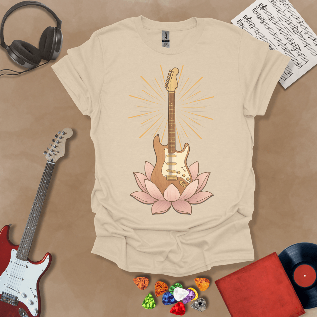 Beige t-Shirt with Electric guitar rising from a pink lotus flower with radiant light beams, symbolic fusion of rock music and spiritual harmony.