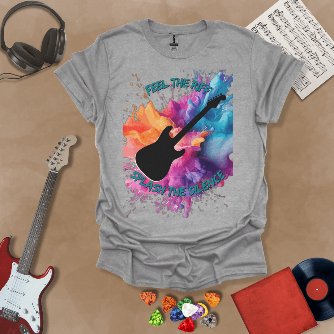 Gray T-shirt with Bold guitar splash design with black silhouette and colorful paint burst, outlined for contrast. Text reads ‘Feel the Riff, Splash the Silence'.