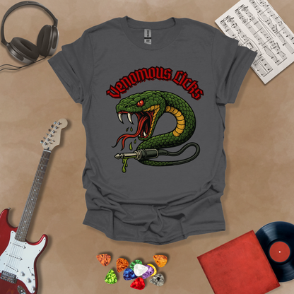 Gray t-shirt with graphic of Green snake striking with fangs bared, wrapped around a guitar cable plug, dripping venom, bold gothic red “Venomous Licks” text above.