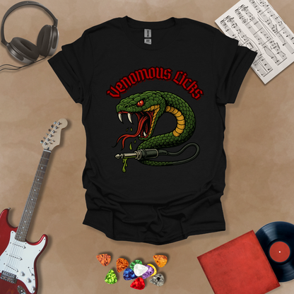 Black t-shirt with graphic of Green snake striking with fangs bared, wrapped around a guitar cable plug, dripping venom, bold gothic red “Venomous Licks” text above.