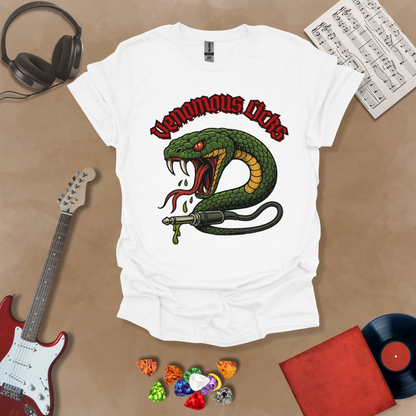White t-shirt with graphic of Green snake striking with fangs bared, wrapped around a guitar cable plug, dripping venom, bold gothic red “Venomous Licks” text above.