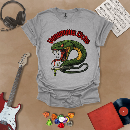 Gray t-shirt with graphic of Green snake striking with fangs bared, wrapped around a guitar cable plug, dripping venom, bold gothic red “Venomous Licks” text above.