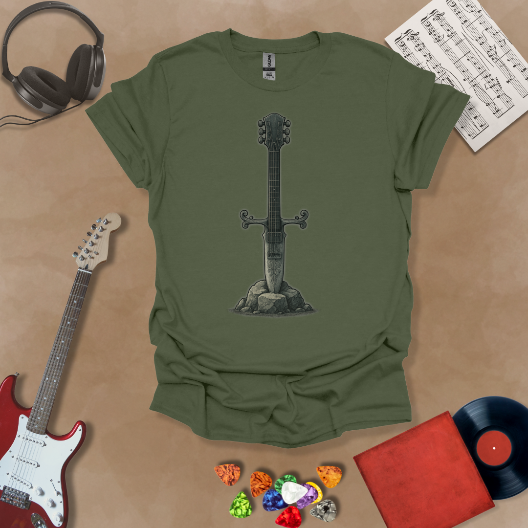 Green t-shirt with Illustration of a battle-worn guitar sword glowing with a smoky gray aura, titled Axecalibur: Forged in Shadow, printed on a dark tee by Riff Junkie.