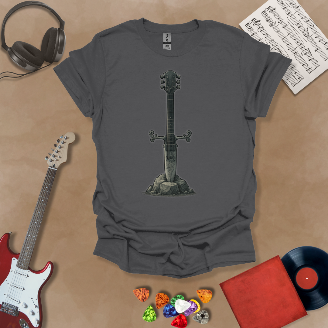 Gray t-shirt with Illustration of a battle-worn guitar sword glowing with a smoky gray aura, titled Axecalibur: Forged in Shadow, printed on a dark tee by Riff Junkie.