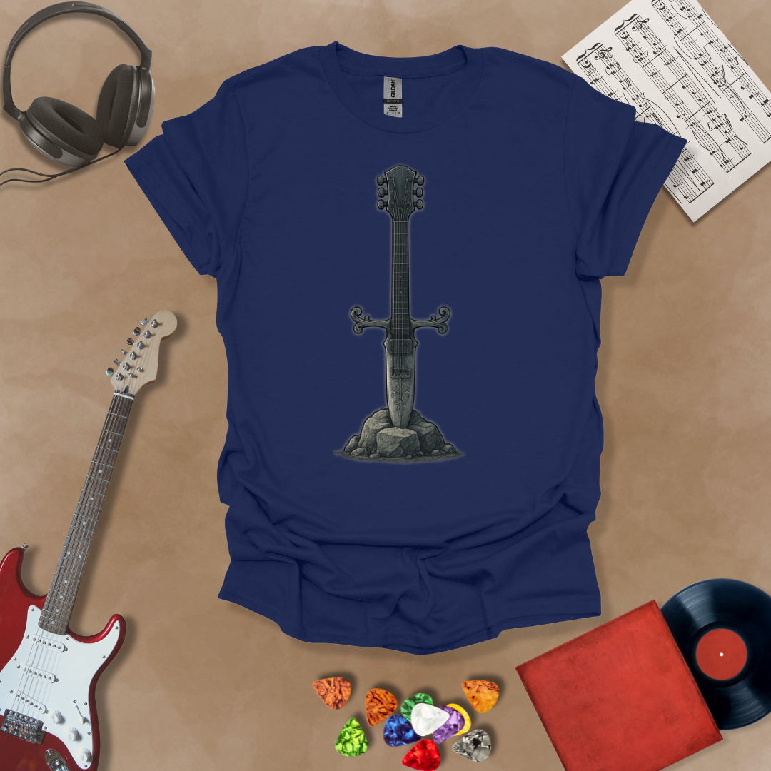 Navy t-shirt with Illustration of a battle-worn guitar sword glowing with a smoky gray aura, titled Axecalibur: Forged in Shadow, printed on a dark tee by Riff Junkie.