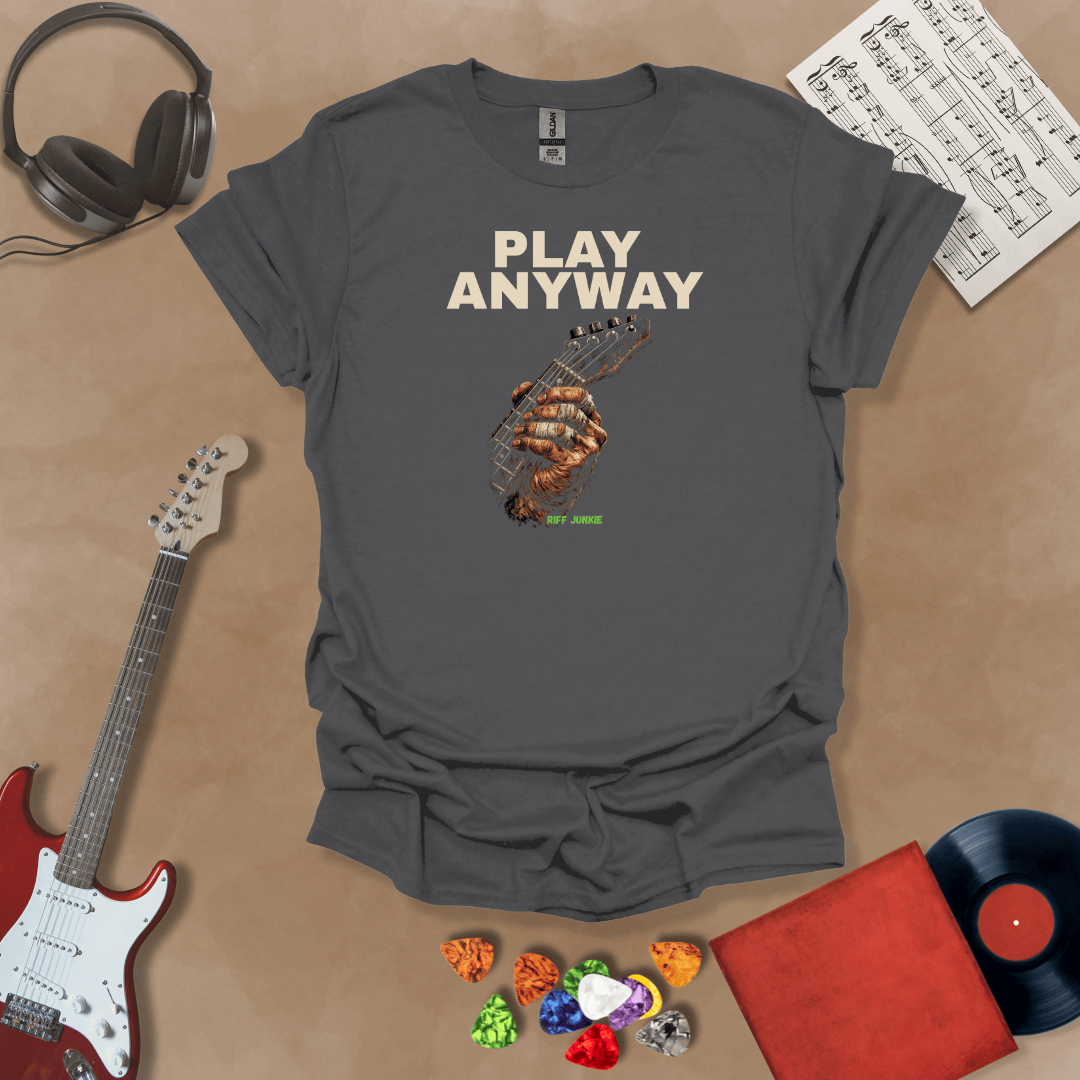 Play Anyway – Riff Edition graphic Gray t-shirt featuring bold stacked text above a weathered hand gripping a guitar fretboard with taped fingers and Riff Junkie branding.