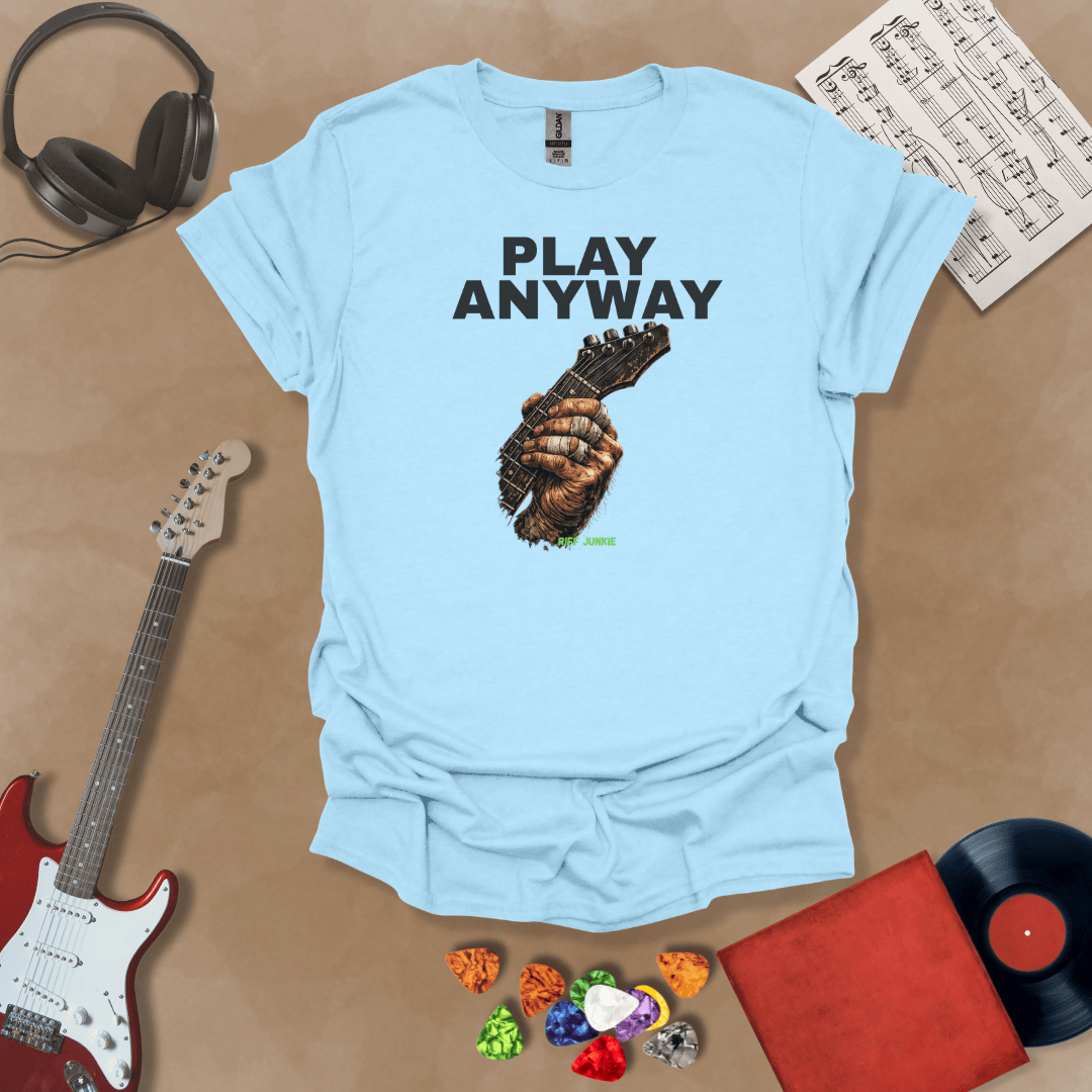 Play Anyway – Riff Edition graphic Blue t-shirt featuring bold stacked text above a weathered hand gripping a guitar fretboard with taped fingers and Riff Junkie branding.